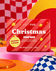 Colourfully packaged Christmas soap featuring a warm cinnamon and citrus fragrance, natural essential oils and bold candy-cane artwork for festive bathroom style.