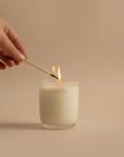 Candle being lit. Tobacco, Leather, Cedarwood, Patchouli, Musk, and Pepper Arthur Betsy 200g candle.