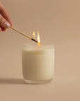 An Arthur Betsy candle being lit.