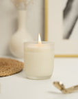 a lit Tobacco, Leather, Cedarwood, Patchouli, Musk, and Pepper Arthur Betsy 200g candle.