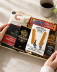 Luxury letterbox gift hamper for him featuring Jack Daniel's whiskey, artisan chocolate, English breakfast tea, sweet chilli peanuts and shortbread presented in a premium Hallby gift box.