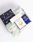 Relax box with space self-heating eye ask, sleep tea bag, 3x scented tea lights, energise bath soak, energise soap bar and milk chocolate bar. Perfect for thank you gifts, Christmas gifts, birthday gifts, congratulations gifts, client gifts, employee gifts or just because gifts.