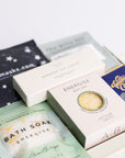 Relax box with space self-heating eye ask, sleep tea bag, 3x scented tea lights, energise bath soak, energise soap bar and milk chocolate bar. Perfect for thank you gifts, Christmas gifts, birthday gifts, congratulations gifts, client gifts, employee gifts or just because gifts.
