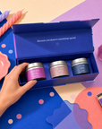Edit Five luxury scented candle gift box containing three 80g gold tin candles with coffee and vanilla, bergamot and warm woods, and tobacco, cedarwood and amber fragrances, offering over 36 hours of home fragrance.