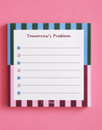 Colourful striped “Tomorrow’s Problem” memo pad with 50 tear-off sheets and a practical tick-box layout for quick notes, daily reminders, shopping lists, brain dumps and to-do lists.