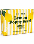 A rectangular bar of soap wrapped in a yellow and white striped paper sleeve decorated with illustrations of lemons and the text 'EDIT FIVE Lemon Poppy Seed SOAP BAR'. Natural lemon essential-oil soap handmade in England with a textured poppy seed exfoliant—a bright, uplifting bathroom essential and thoughtful self-care gift for her or him.