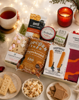 Luxury Christmas letterbox gift hamper featuring gingerbread popcorn, Candy Lane flapjack, buttery shortbread, peppermint tea, cinnamon toast blonde chocolate, artisan sourdough crackers and Christmas chutney presented in a premium Hallby gift box.