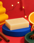 Handmade 100g Christmas soap scented with warming cinnamon and sweet orange essential oils, creating a rich, creamy lather and comforting seasonal fragrance.