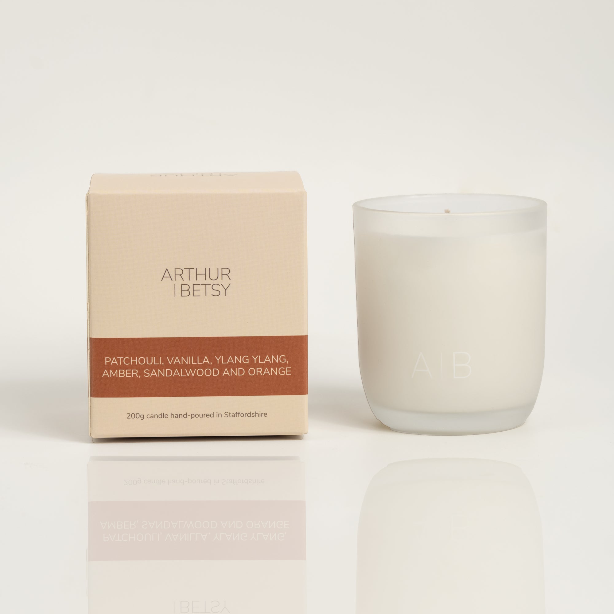 Patchouli, Vanilla, Ylang Ylang, Amber, Sandalwood and Orange Arthur Betsy 200g candle and branded Arthur Betsy box.