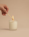 An Arthur Betsy candle being lit.