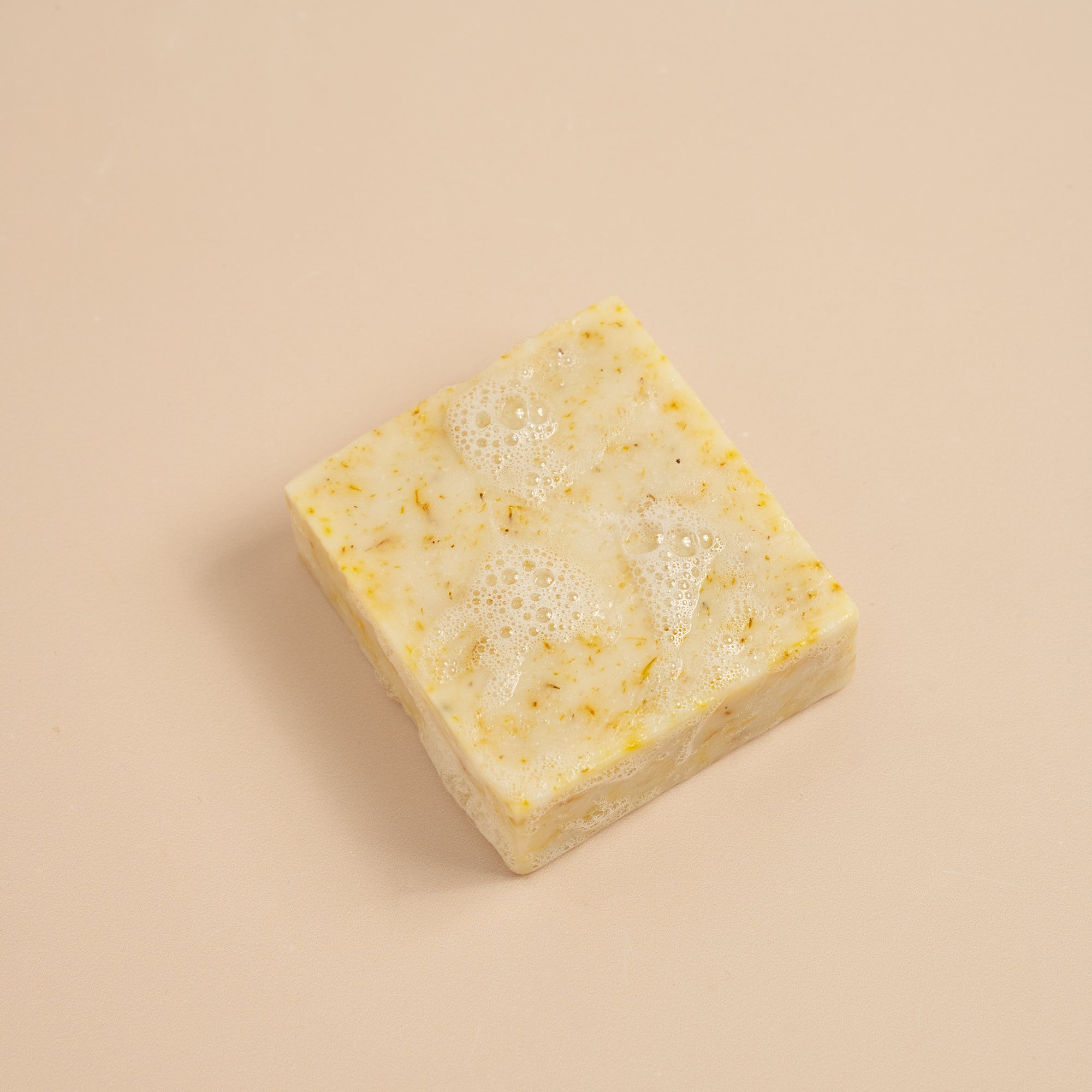 A bubbly Energise soap bar, with scents of lemon, clementine, ylang ylang and patchouli essential oils