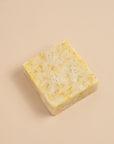 A bubbly Energise soap bar, with scents of lemon, clementine, ylang ylang and patchouli essential oils