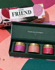 “Lovely Friend” luxury candle gift set featuring three scented gold candle tins presented inside a colourful premium magnetic keepsake box, perfect as a thoughtful gift for a friend.