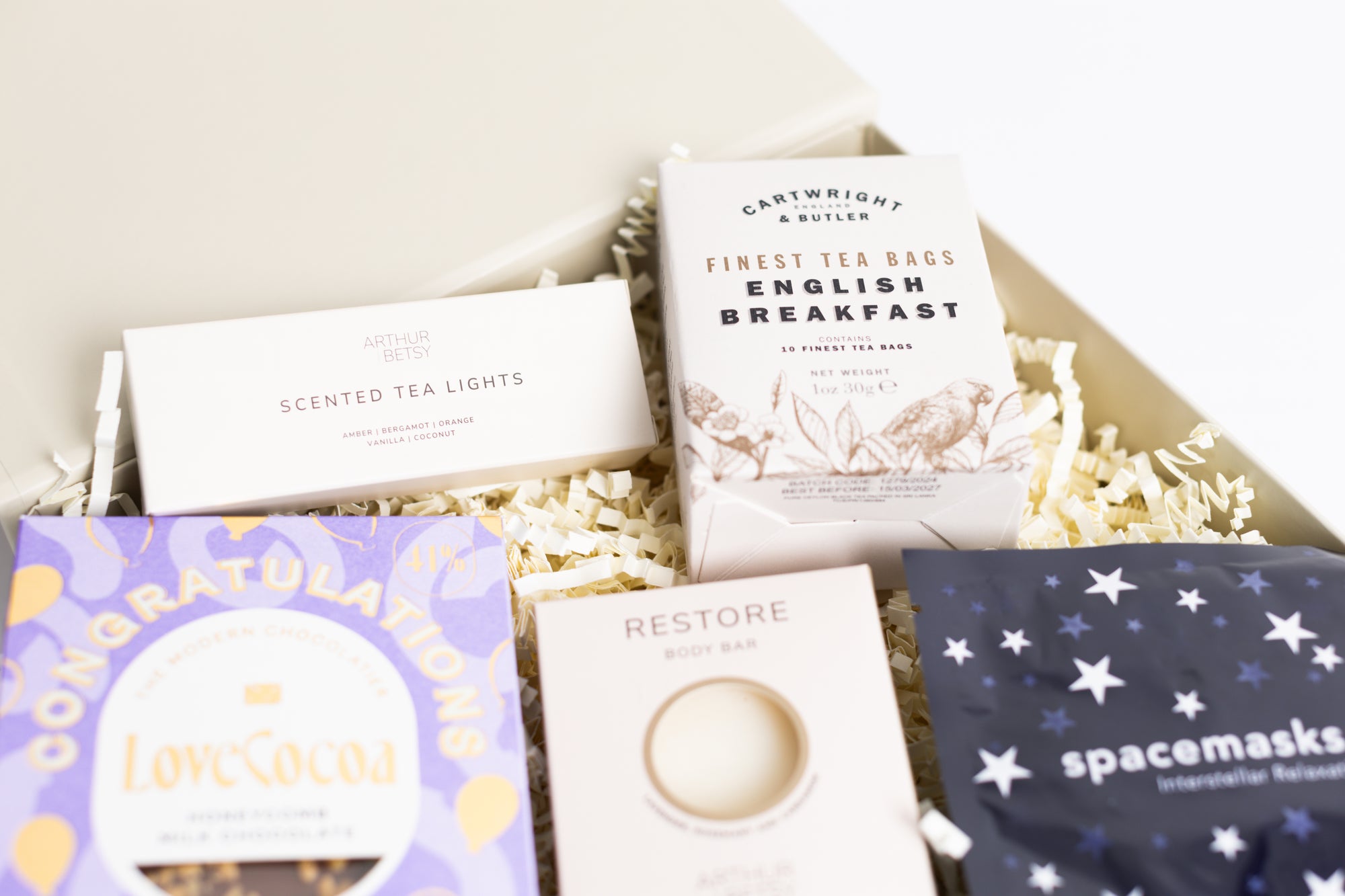 Congratulations gift box with Love cocoa congratulations chocolate slab, 3x scented tea lights set, English breakfast tea bags, restore soap bar, space self-heating eye mask. Perfect for mum, dad, sister, friend, employee, client, daughter, son.