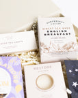 Congratulations gift box with Love cocoa congratulations chocolate slab, 3x scented tea lights set, English breakfast tea bags, restore soap bar, space self-heating eye mask. Perfect for mum, dad, sister, friend, employee, client, daughter, son.