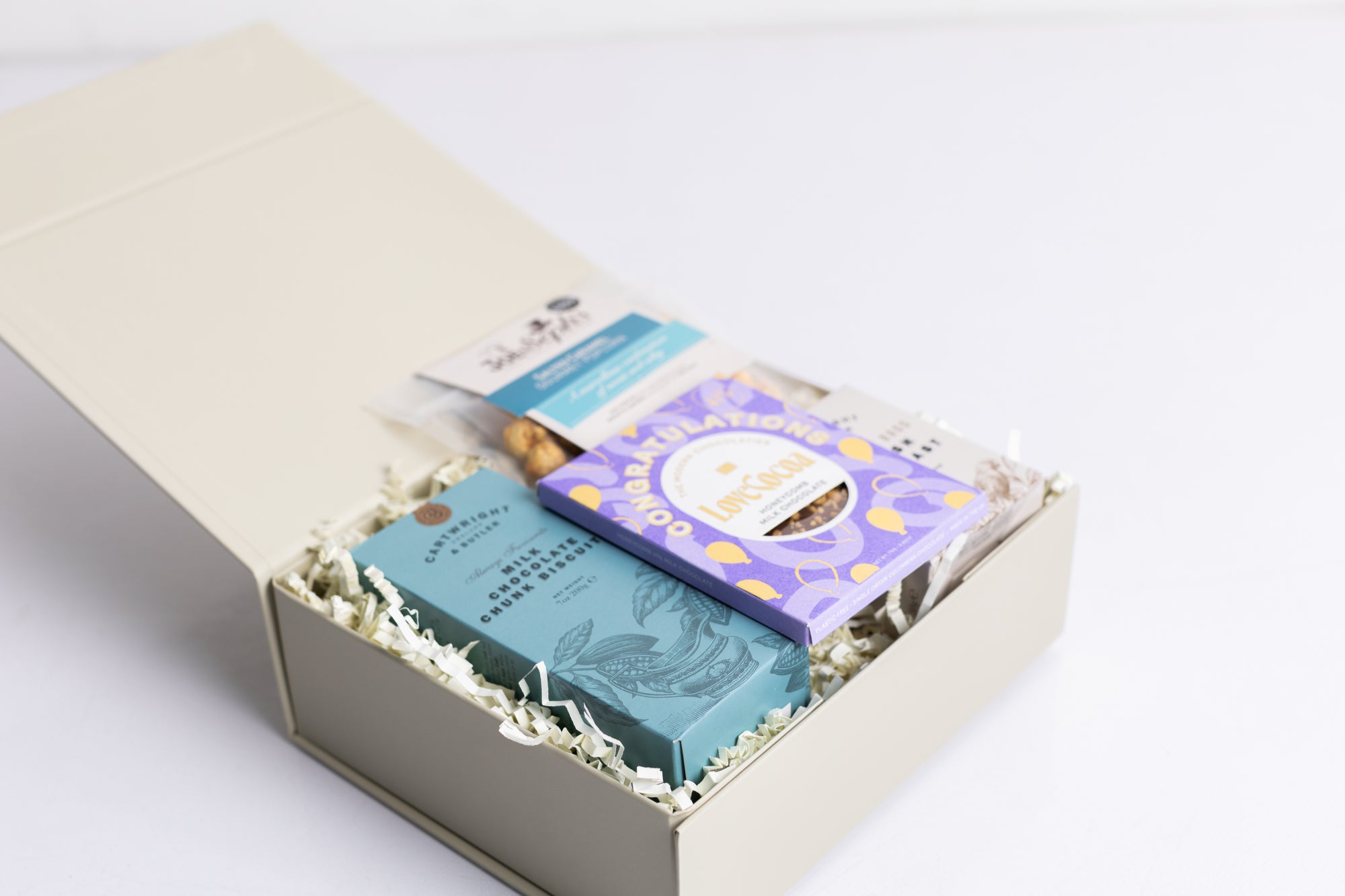 Congratulations Hamper with Milk chocolate chunk biscuits, Love cocoa congratulations chocolate slab, salted caramel popcorn and English breakfast tea bags. Perfect for mum, dad, sister, friend, employee, client, daughter, son.