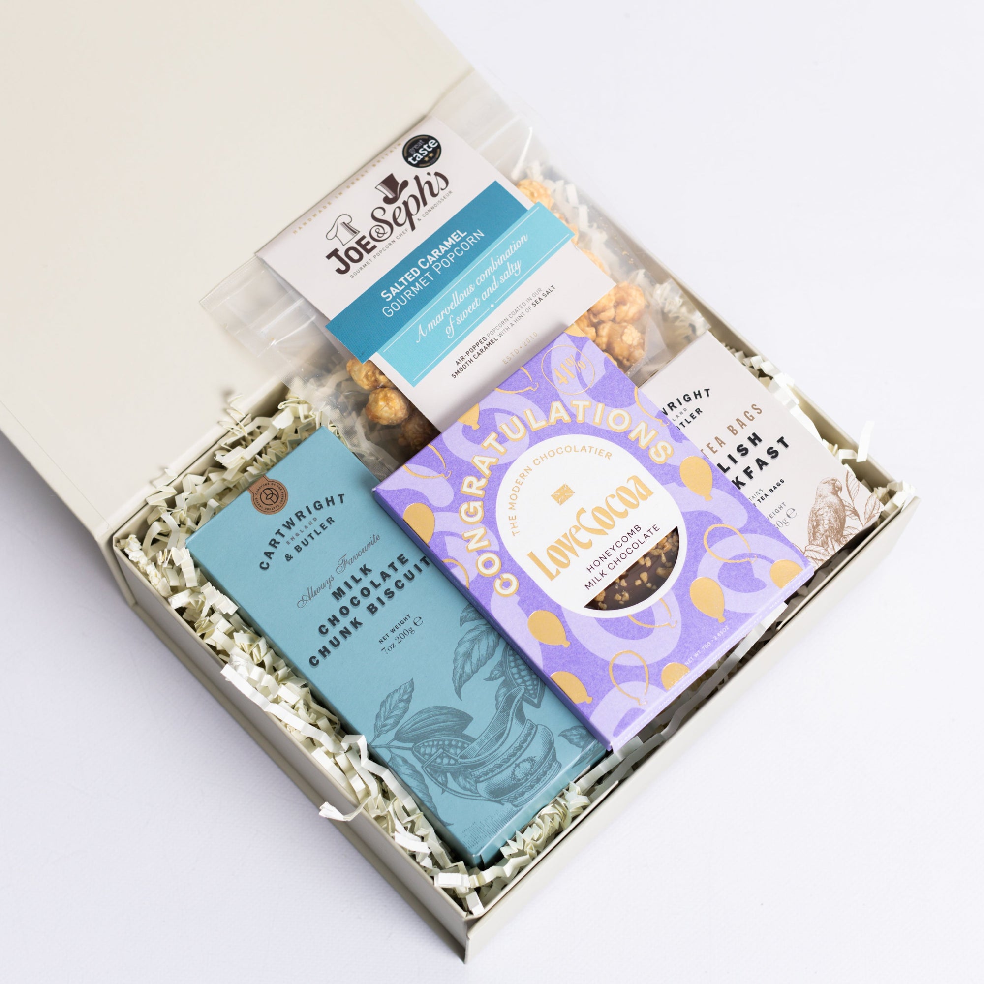 Congratulations Hamper with Milk chocolate chunk biscuits, Love cocoa congratulations chocolate slab, salted caramel popcorn and English breakfast tea bags. Perfect for mum, dad, sister, friend, employee, client, daughter, son.