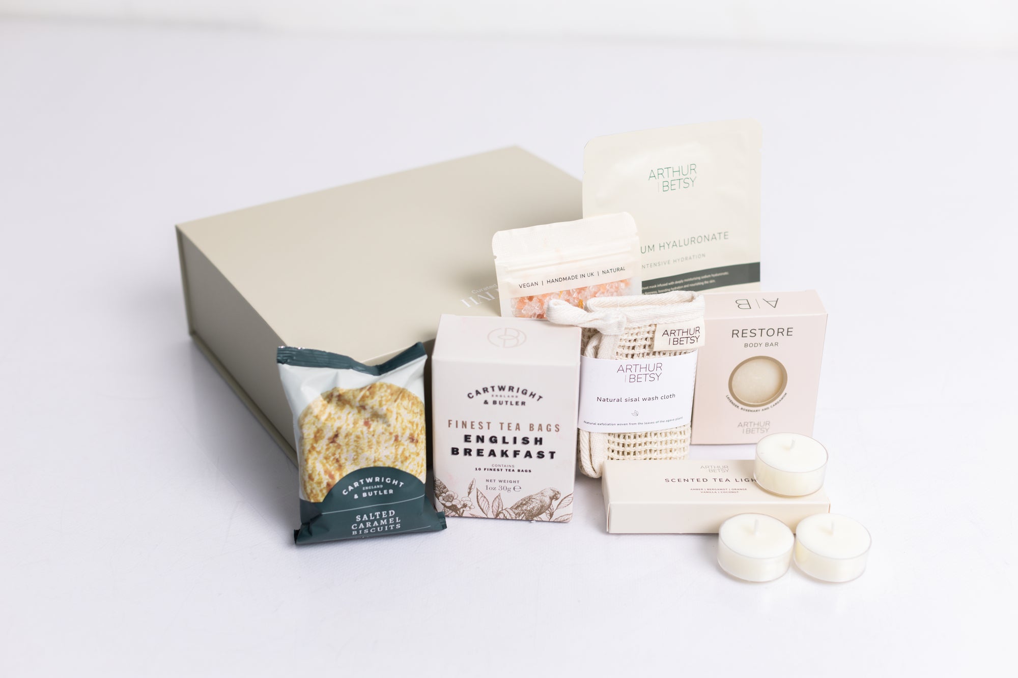 Head to toe spa box with sheet mask, natural sisal wash cloth, salted caramel biscuits, 3x scented tea lights, restore bath soak, English breakfast tea bags Perfect for thank you gifts, Christmas gifts, birthday gifts, congratulations gifts, client gifts, employee gifts or just because gifts.