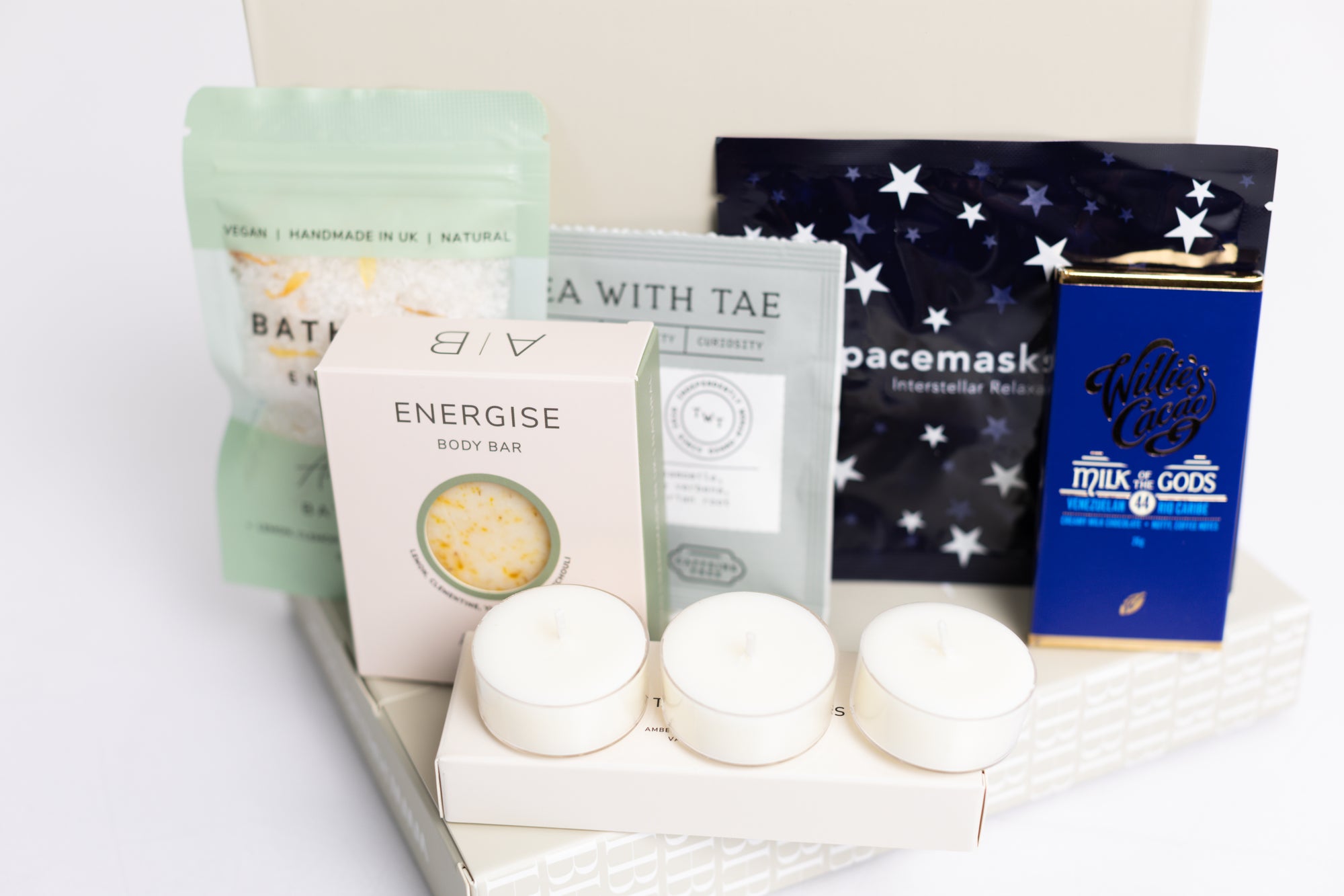 Relax box with space self-heating eye ask, sleep tea bag, 3x scented tea lights, energise bath soak, energise soap bar and milk chocolate bar. Perfect for thank you gifts, Christmas gifts, birthday gifts, congratulations gifts, client gifts, employee gifts or just because gifts.