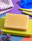 Handmade 100g artisan soap scented with soothing lavender and refreshing lemongrass essential oils, creating a rich lather and relaxing floral-citrus fragrance.