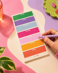 Long portrait weekly planning notepad featuring dedicated Monday to Sunday sections, colourful Edit Five stationery design and space for weekly priorities, to-do lists, meals and reminders.
