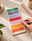 Bright rainbow weekly organiser pad for home, work or study, with 50 tear-off planning sheets for managing family schedules, appointments, meal planning, timetables and weekly tasks.