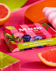A boxed soap bar package labeled 'EDIT FIVE Mum SOAP BAR' in Pink Grapefruit scent, styled on a bright pink surface with sliced grapefruit, a striped cloth, and acrylic blocks. Edit Five pink grapefruit soap bar designed especially for mums, featuring natural essential oils and beautiful packaging—ideal as a pampering gift, self-care present or gift-box addition.