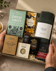 Luxury men's gift hamper in a premium magnetic gift box featuring Jack Daniel's whiskey, artisan cheese sablés, fine blend coffee, English Breakfast tea, Nordic Pine wool socks, energising body bar and Willie's Cacao dark chocolate.