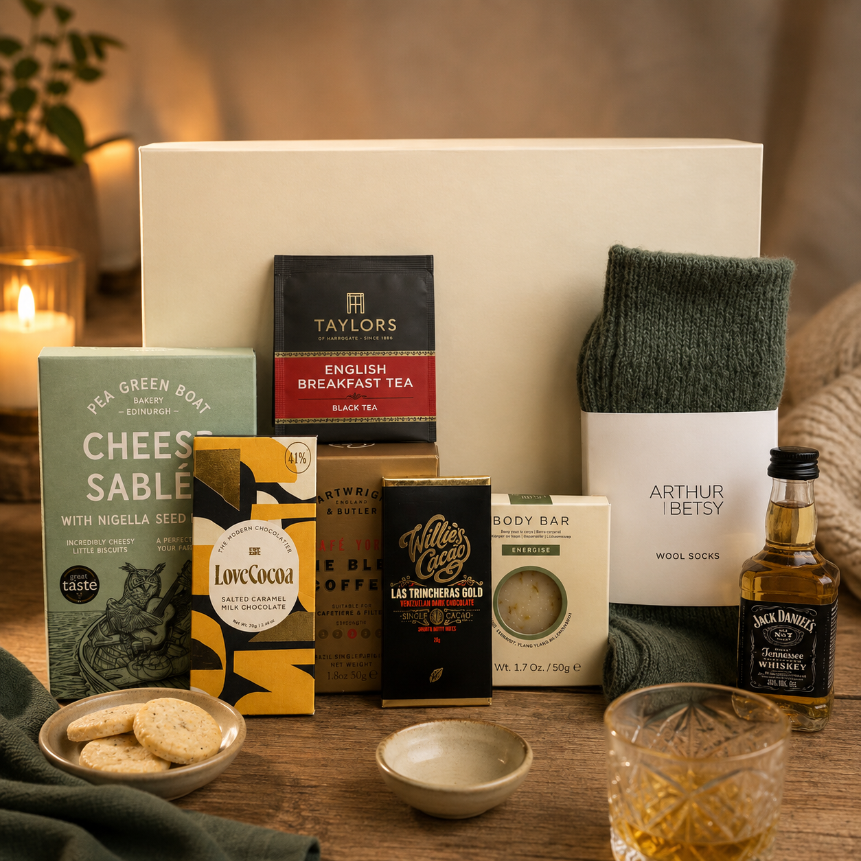 Luxury men's gift hamper in a premium magnetic gift box featuring Jack Daniel's whiskey, artisan cheese sablés, fine blend coffee, English Breakfast tea, Nordic Pine wool socks, energising body bar and Willie's Cacao dark chocolate.