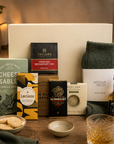 Luxury men's gift hamper in a premium magnetic gift box featuring Jack Daniel's whiskey, artisan cheese sablés, fine blend coffee, English Breakfast tea, Nordic Pine wool socks, energising body bar and Willie's Cacao dark chocolate.