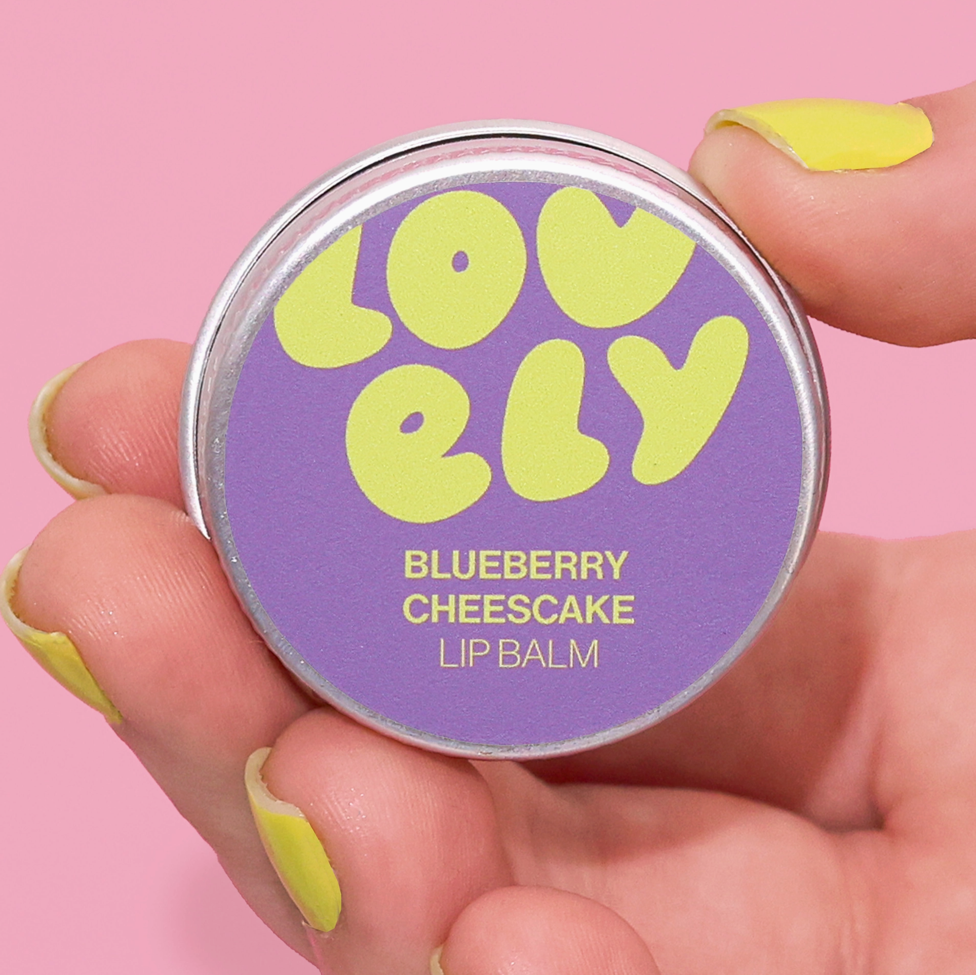 Lip balm container labeled 'Lovely Blueberry Cheesecake' 