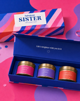 “Fabulous Sister” luxury candle gift set featuring three scented gold candle tins presented inside a colourful premium magnetic keepsake box, perfect as a thoughtful gift for your sister.