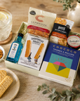 Luxury thank you letterbox gift hamper with Thanks a Million chocolate bar, Bombay Sapphire gin, sweet chilli peanuts and cashews, artisan shortbread, sourdough crackers and strawberry conserve in a premium Hallby gift box.